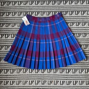 Vintage Rene Portier wool plaid knee skirt, size 8. Good vintage condition.